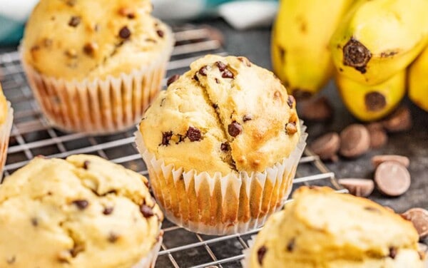 Banana chocolate chip muffins on a cooling rack.