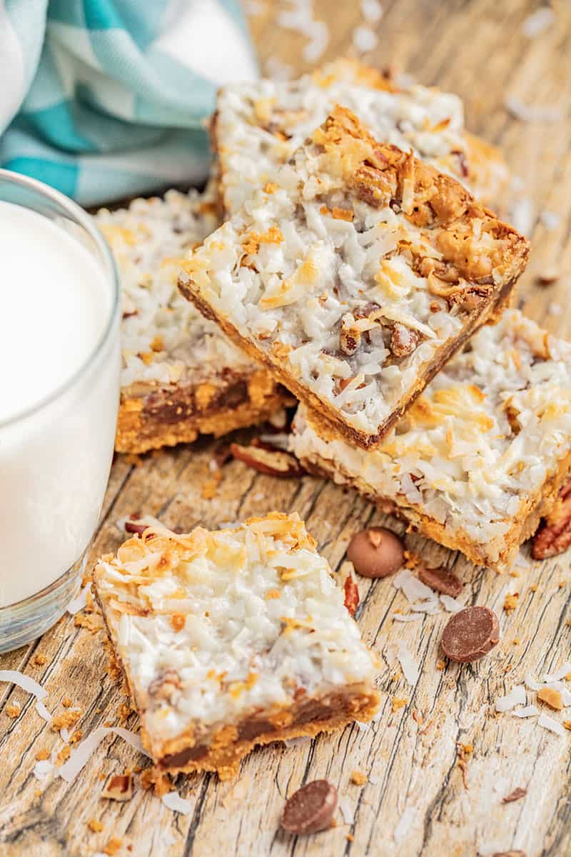 7 layer bars next to a glass of milk.