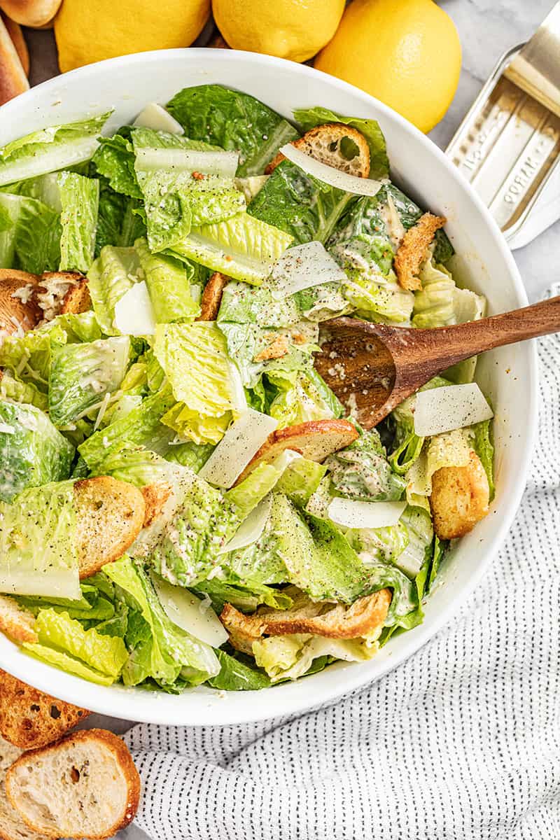 Overhead view of a large bowl of Caesar salad.