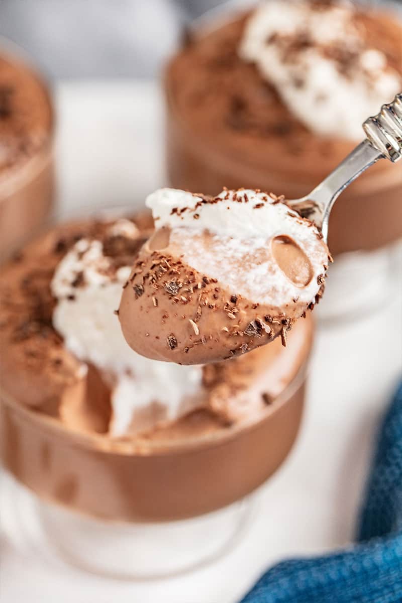 A spoon of chocolate mousse.