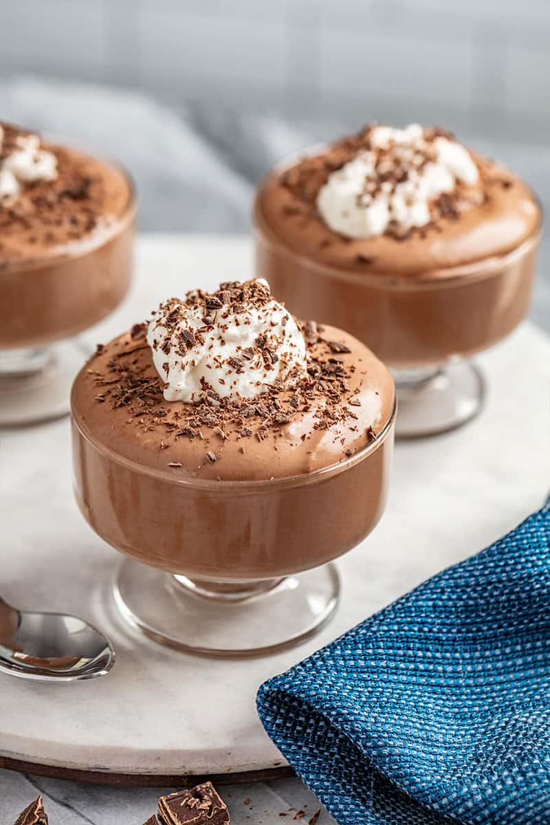 Chocolate mousse with chocolate shavings and whipped cream on top.
