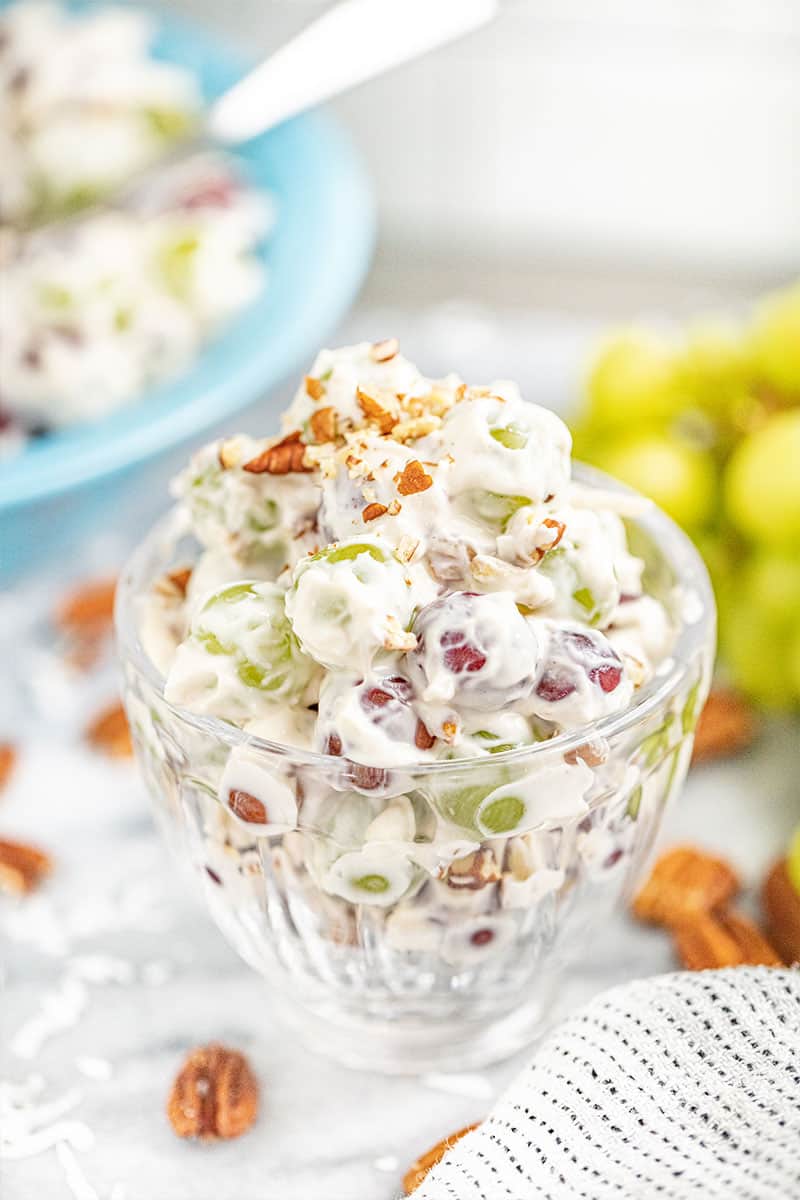 Creamy grape salad in a small glass bowl.