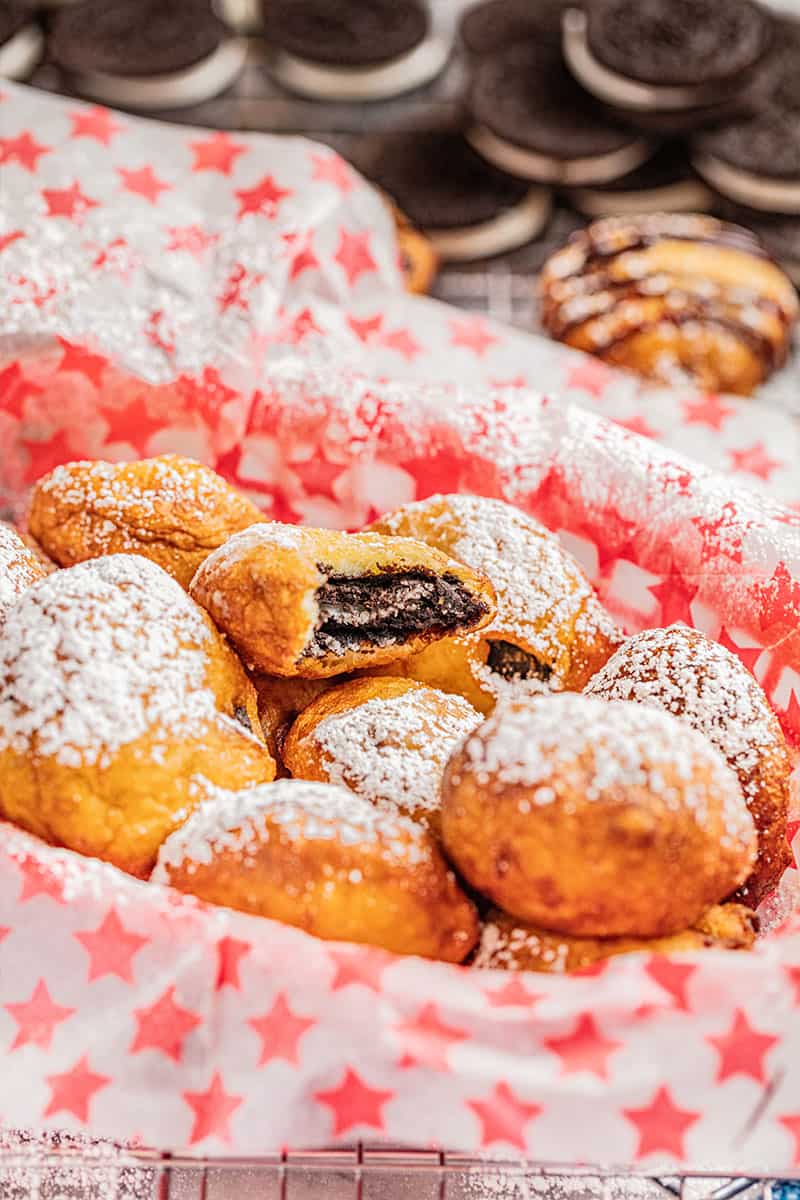 Deep fried Oreos in a paper lined container.