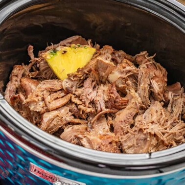 Kalua pork with pineapple in a slow cooker.