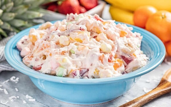 Ambrosia salad in a blue bowl.