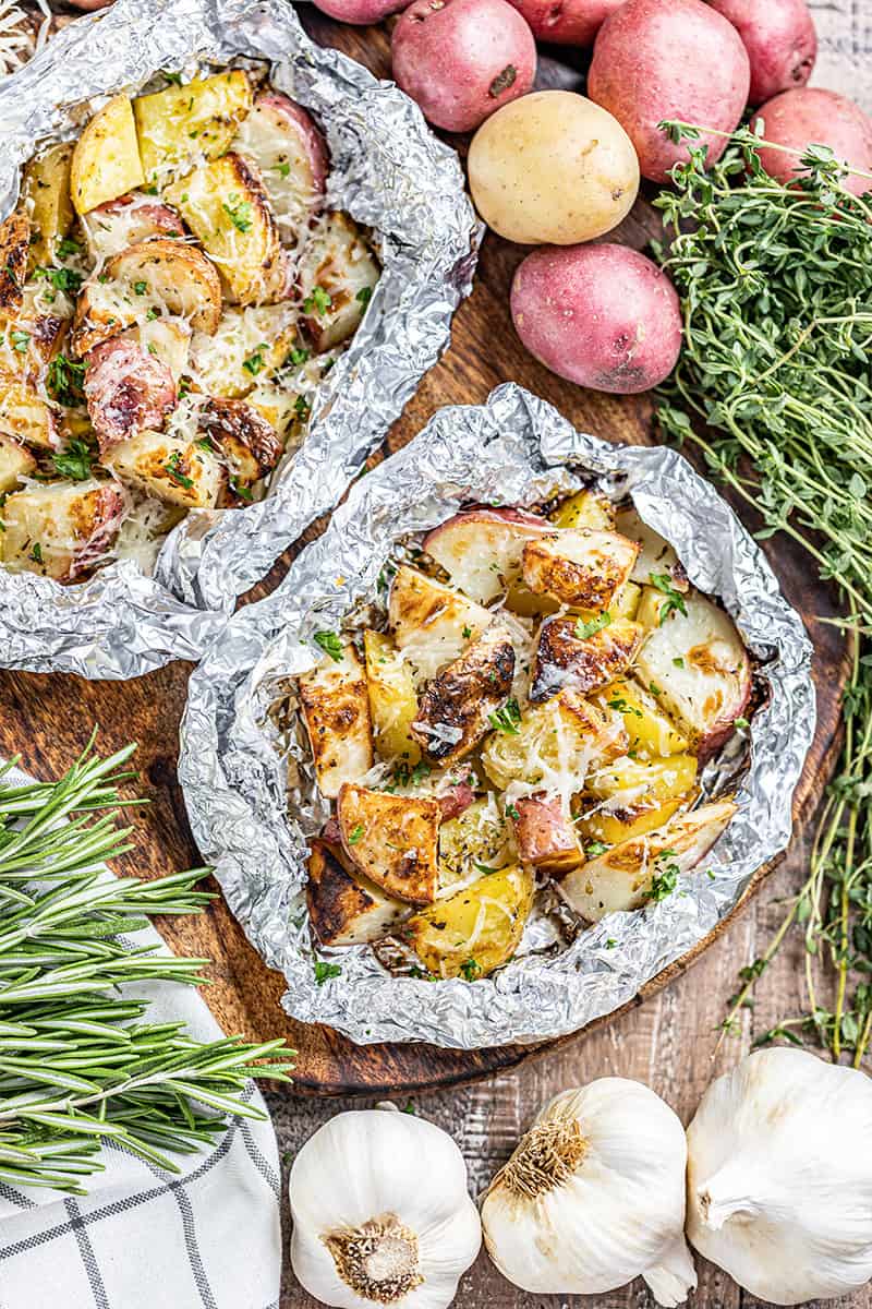 Overhead view of grilled potatoes in a foil packet.