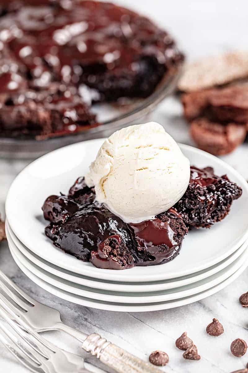 A slice of Mississippi mud pie with a scoop of ice cream on top.