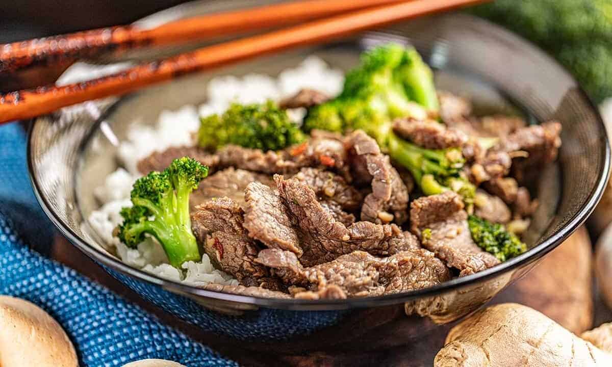 Takeout style beef and broccoli in a dinner bowl.