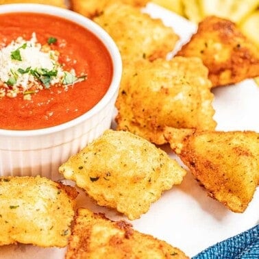 Fried ravioli with dipping sauce.