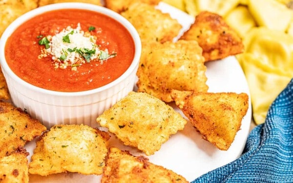 Fried ravioli with dipping sauce.