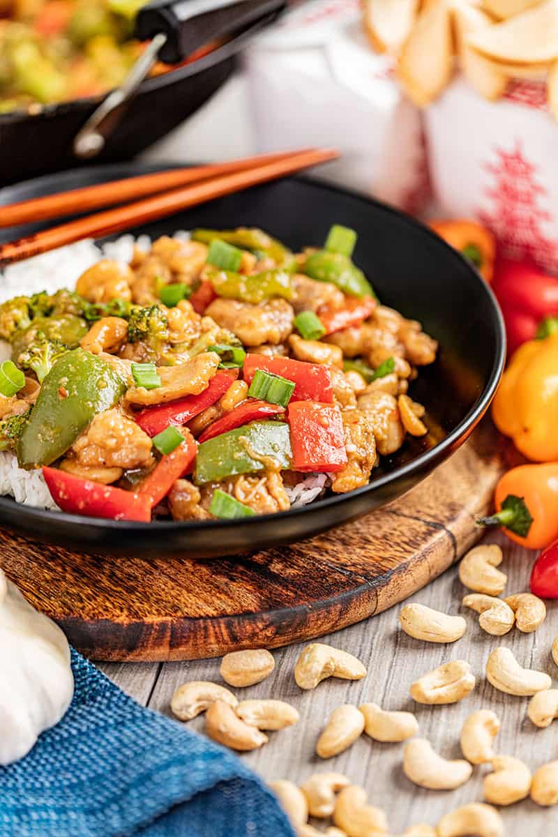 Takeout cashew chicken in a dinner bowl.