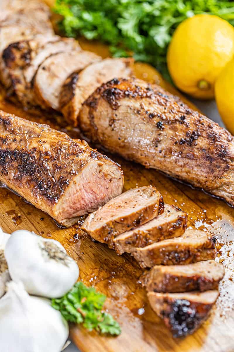 Pork tenderloin on a cutting board.