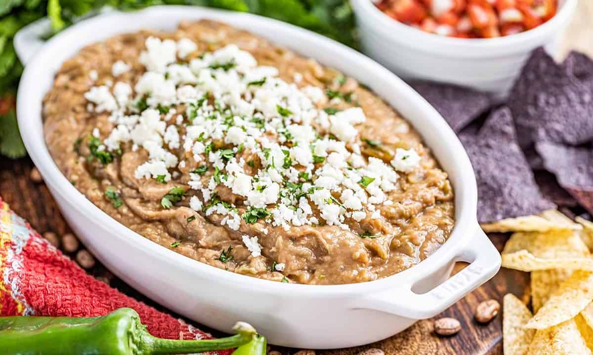 The most amazing bean dip in a white baking dish.
