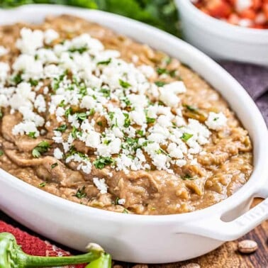 The most amazing bean dip in a white baking dish.