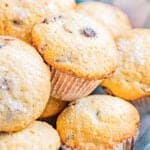 Orange cranberry muffins in a basket.