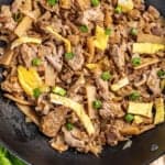 Overhead view of moo shu pork in a wok.