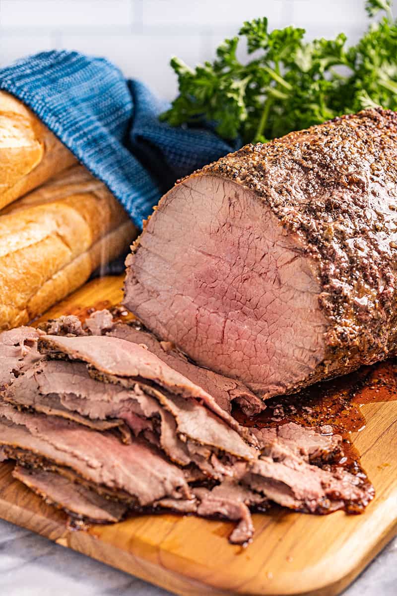 Classic roast beef with a few slices carved off.