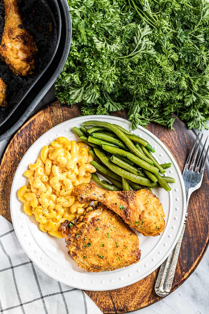 Overhead view of a dinner plate with fried chicken.