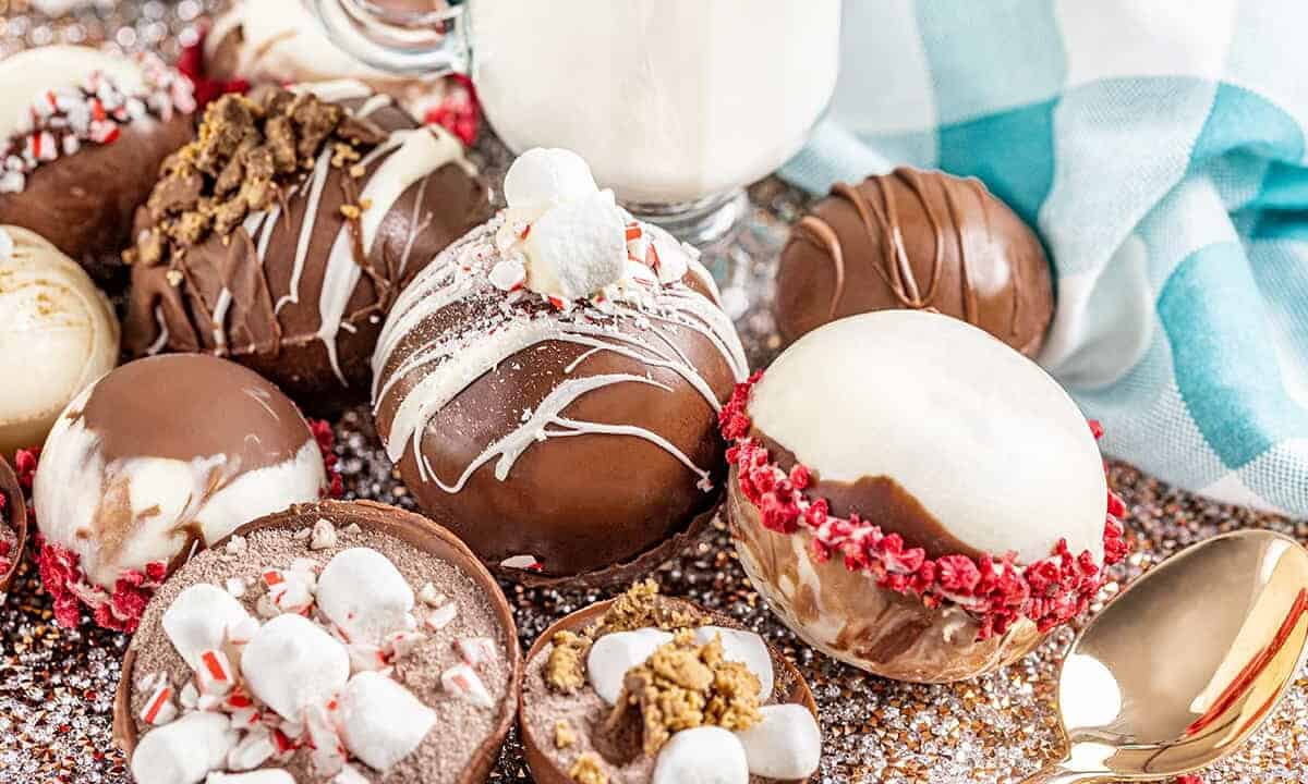 Various hot chocolate bombs on a platter.
