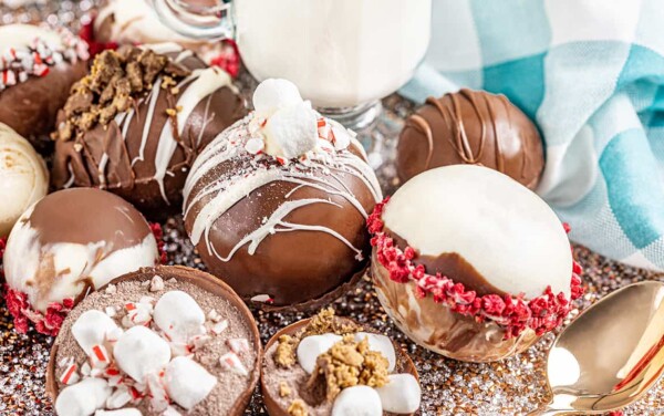 Various hot chocolate bombs on a platter.