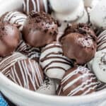A white bowl filled with Oreo truffles.