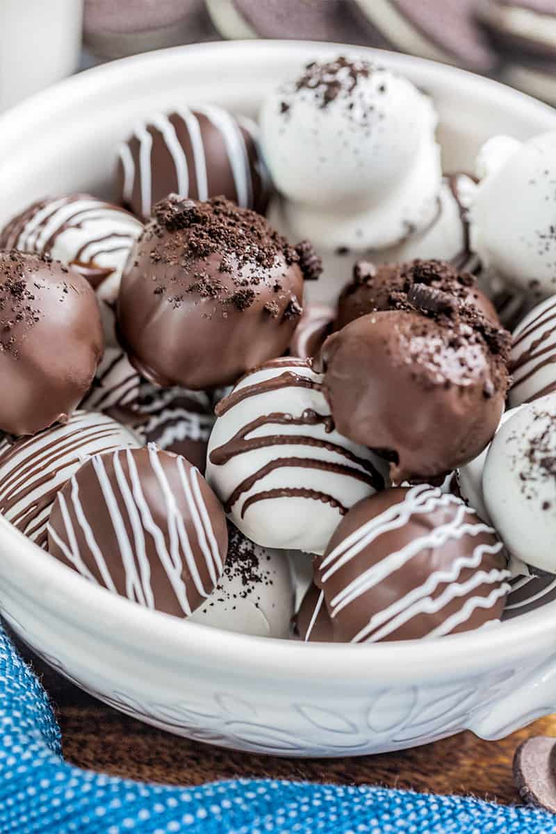 A white bowl filled with Oreo truffles.