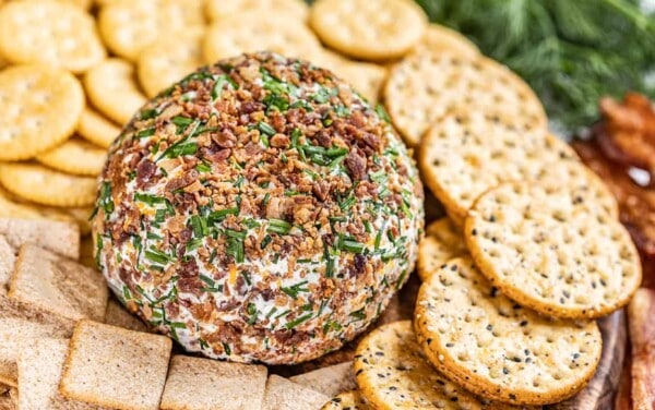 Close up view of a cheeseball with crackers.