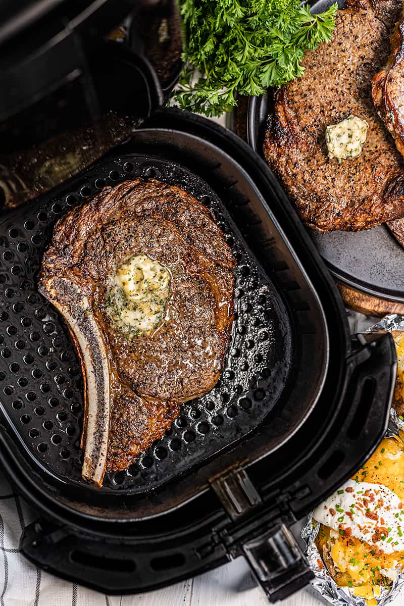 Overhead view of a steak in an air fryer.