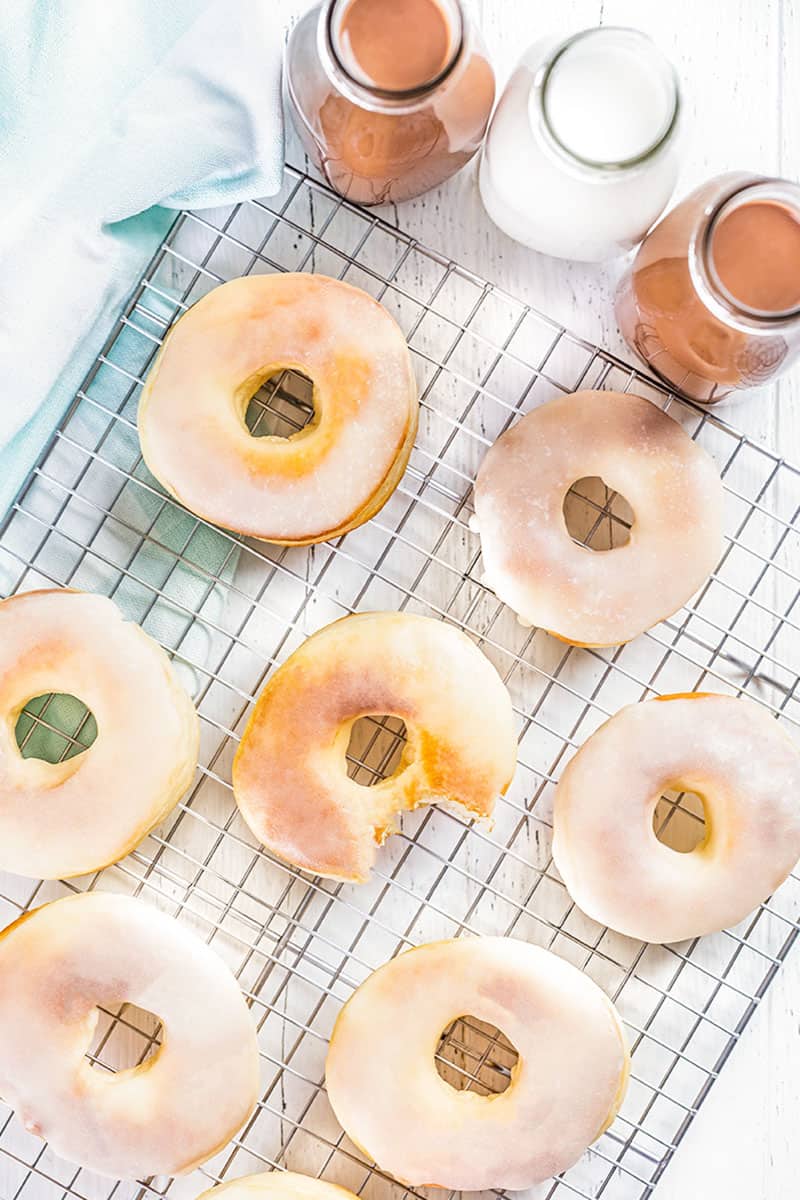 Overhead view of air fryer donuts on a cooling rack.