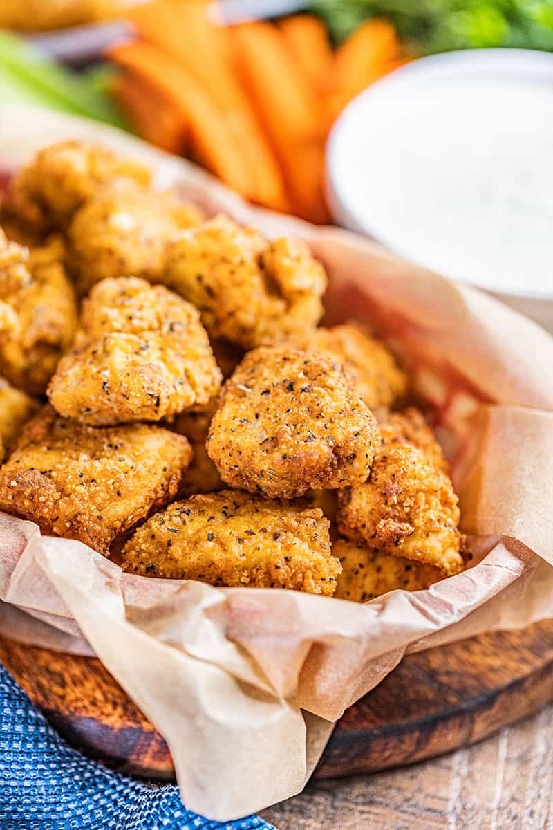 Close ups iew of buffalo chicken bites in a serving bowl.