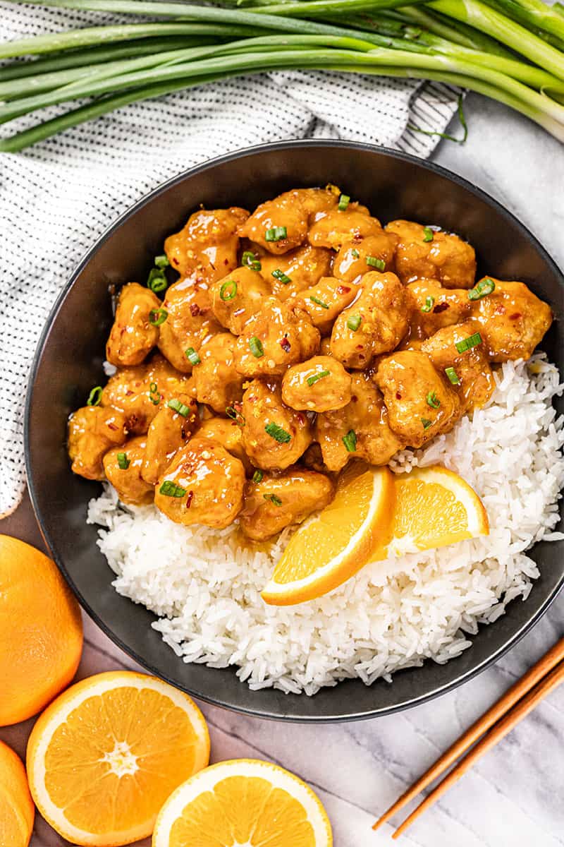 Overhead view of orange chicken and rice.