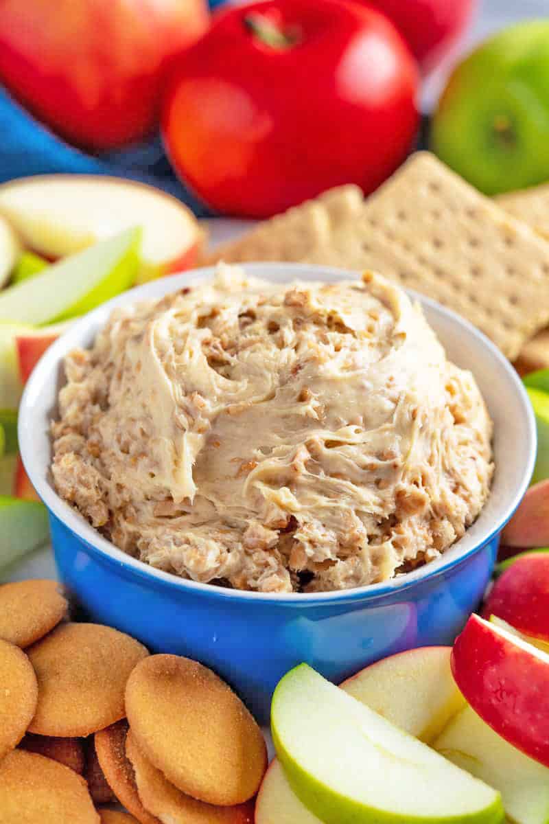 Toffee Apple Dip in a bowl surrounded by apples, graham crackers, and Nilla wafers.