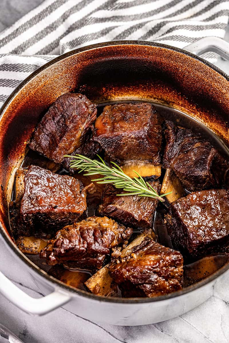 A stockpot filled with braised beef short ribs.