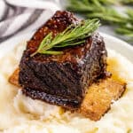 Braised beef short ribs on top of mashed potatoes.