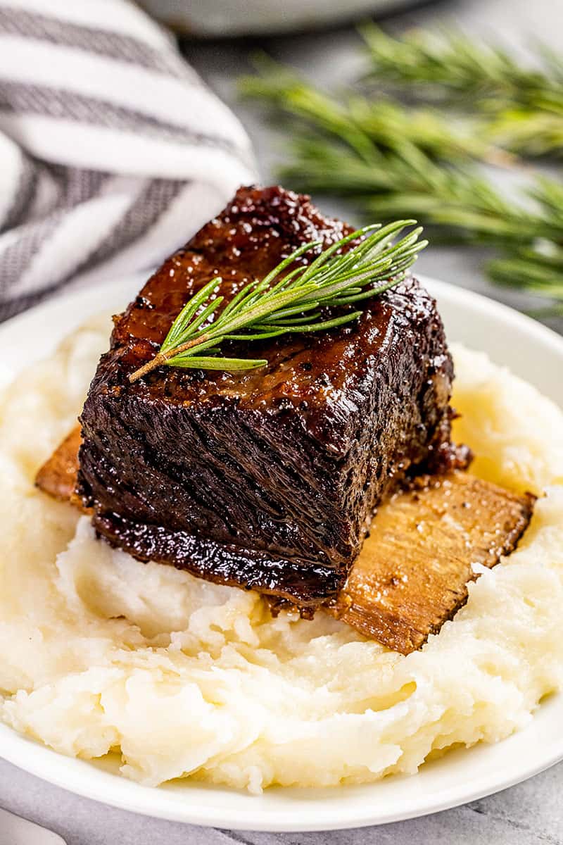 Braised beef short ribs on top of mashed potatoes.