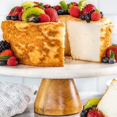 An angel food cake with a slice removed.