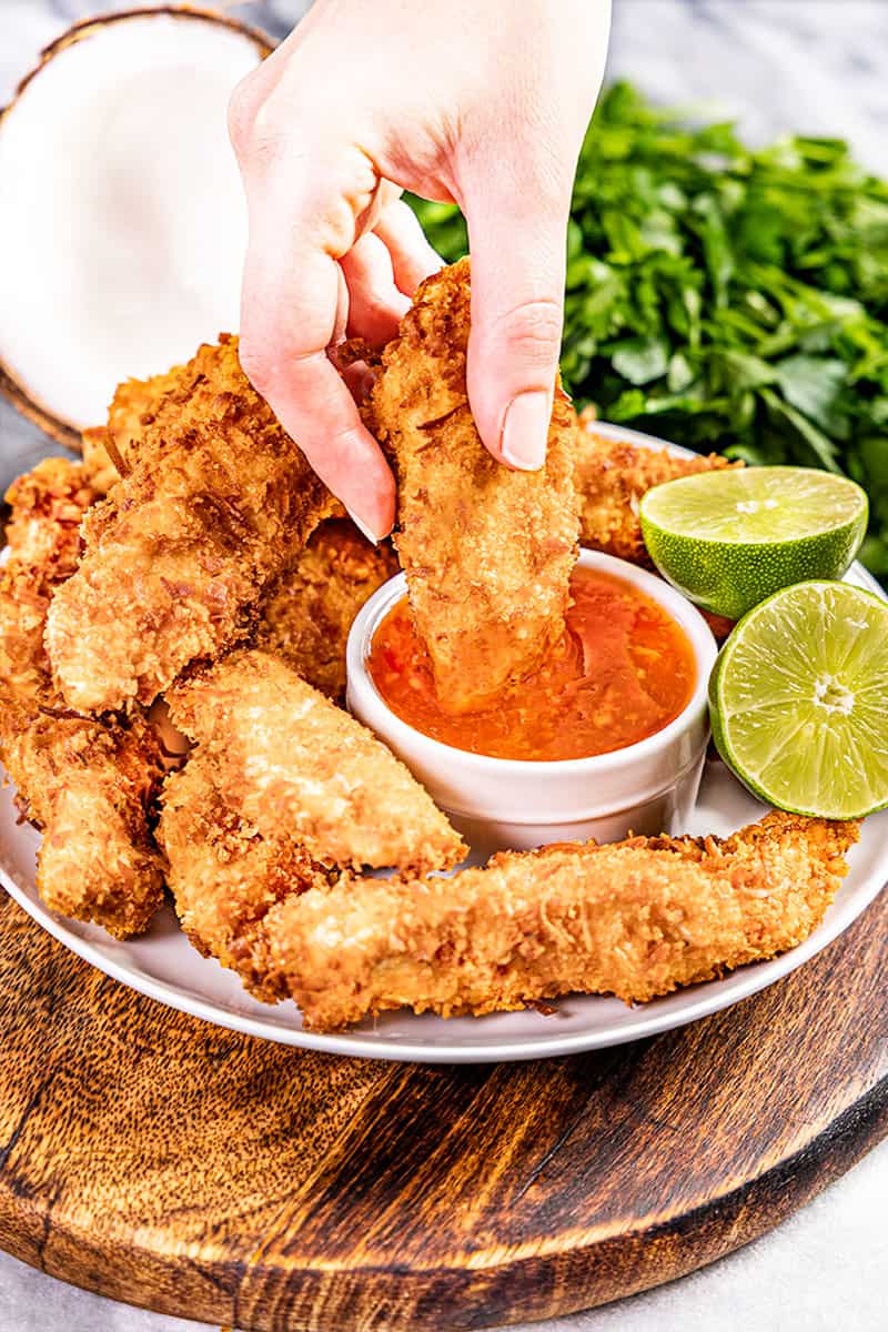 Coconut chicken dipped into a homemade dipping sauce.