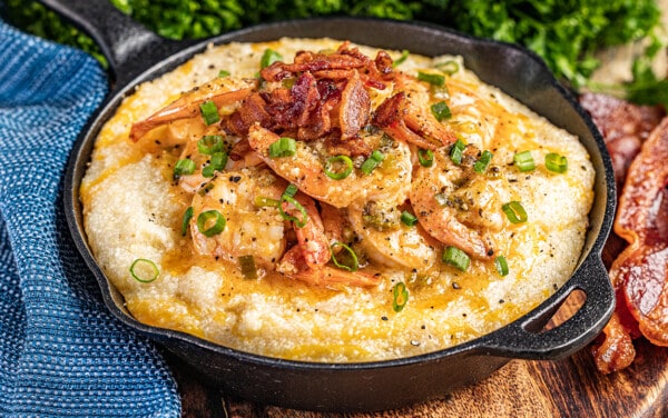 Shrimp and grits in a cast iron pan.