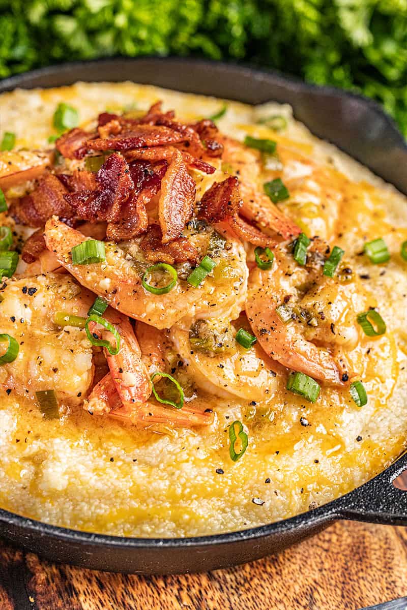 Close up view of shrimp and grits in a pan.
