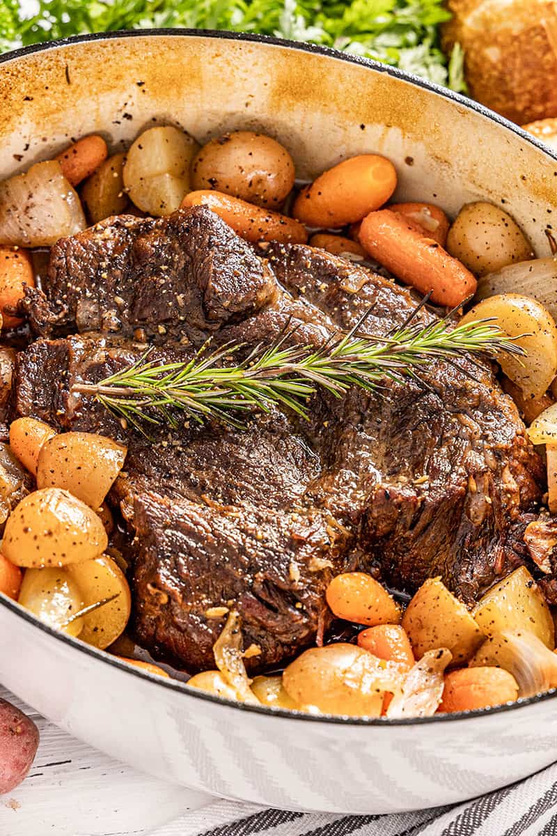 Close up view of pot roast in a pot.