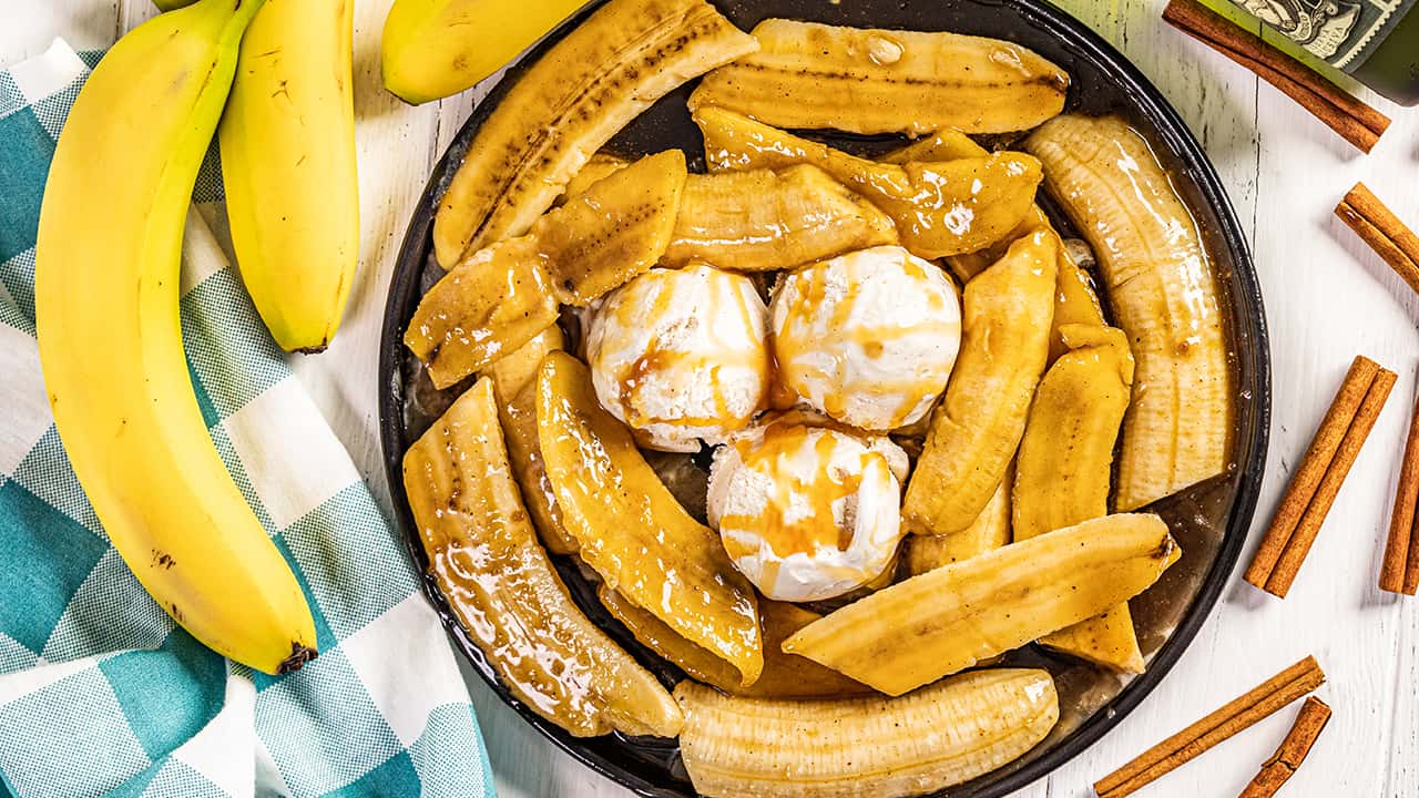 Overhead view of bananas foster on a plate.