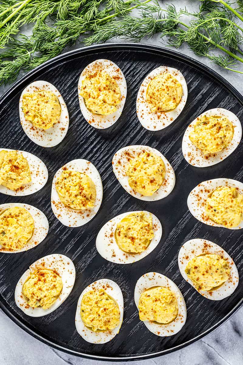 Overhead view of deviled eggs on a tray.