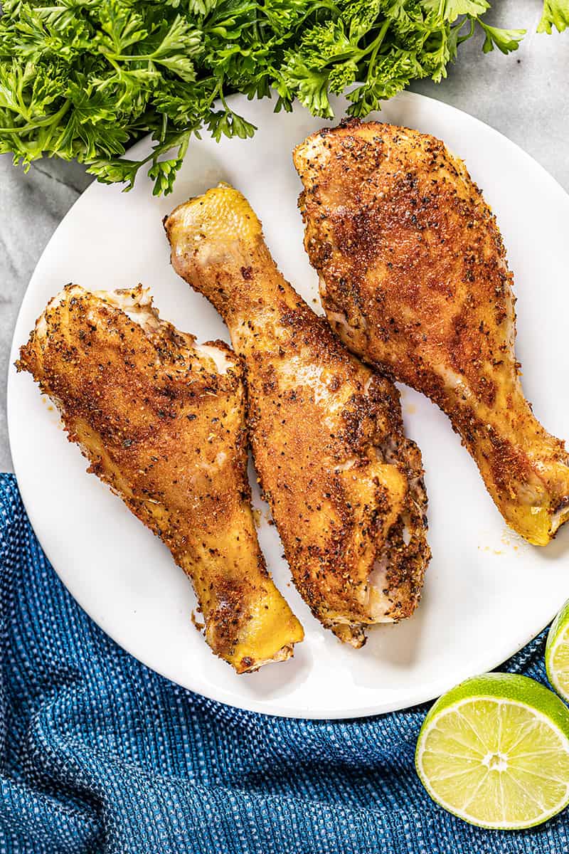 Overhead view of baked chicken drumsticks.