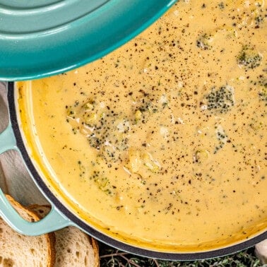 Overhead view of a large pot filed with broccoli cheddar soup.