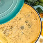 Overhead view of broccoli cheddar soup in a stockpot.