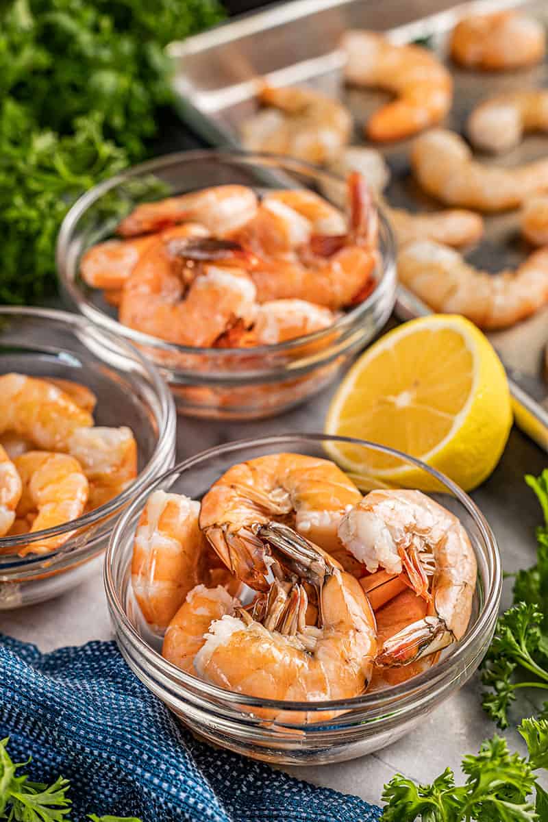 Bowls of cooked shrimp.