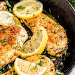 Close up view of lemon chicken in a skillet.