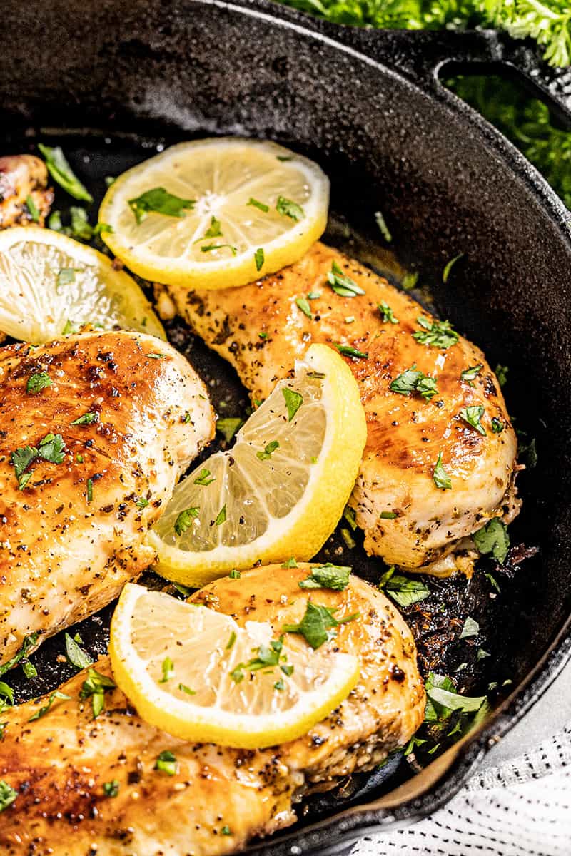 Close up view of lemon chicken in a skillet.