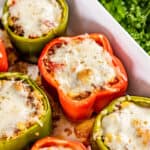 Stuffed bell peppers in a baking dish.