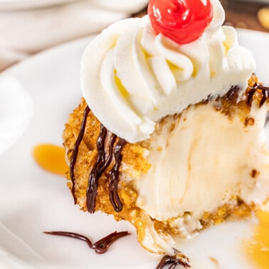 Close up view of fried ice cream with a bite removed.